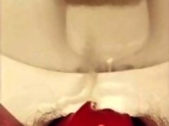 Wetting on toilet in too tight panties while rubbing hairy pussy to orgasm