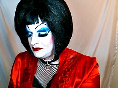 Sissy sub with heavy makeup smokes while talking dirty on camera